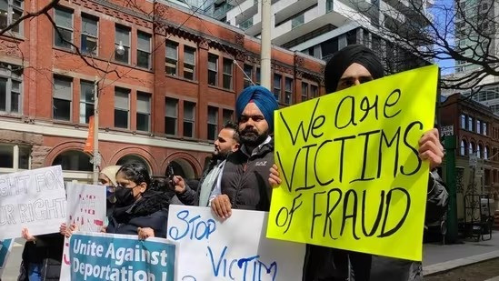 Former Indian students facing deportation from Canada over fake documents protest.
