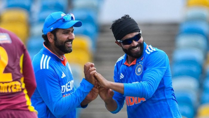 Ravindra Jadeja celebrates after taking a wicket with Rohit Sharma