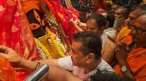 Shuvendur prays to his mother by performing puja at Kalighat temple