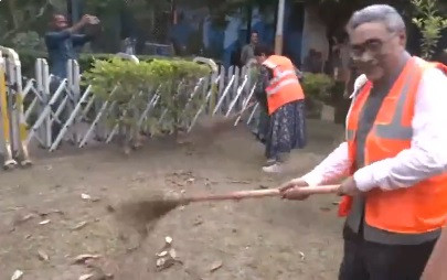 Cleanliness drive in Bhabanipur; Agnimitra joins the cleanup campaign, broom in hand.