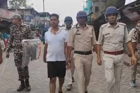 The police made the arrested Jahangir walk on the street wearing only shorts and a vest.