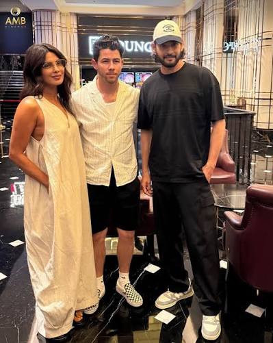 Priyanka Chopra, Nick Jonas and Mahesh Babu pose together during a movie night in Hyderabad.